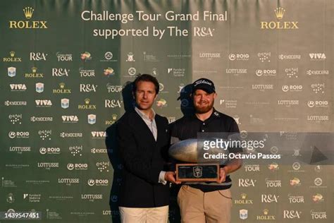 Nathan Kimsey of England receives by Cedric Muller, from Rolex 